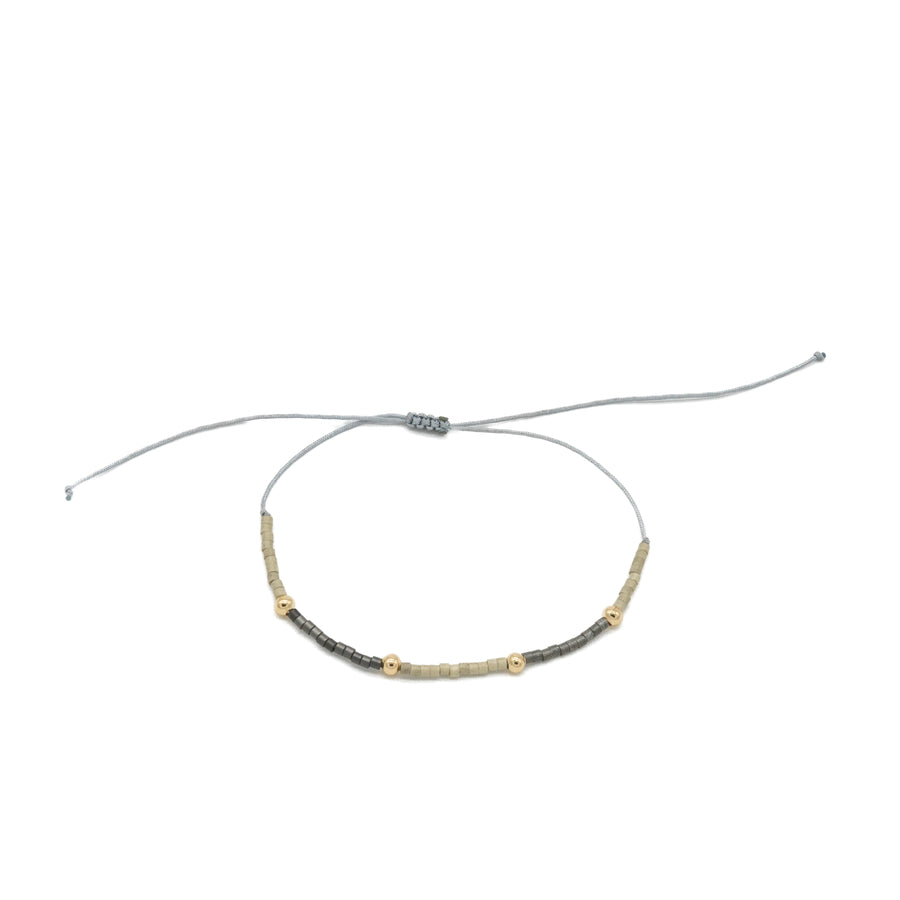 Pulsera de hilo con dorado y miyuki