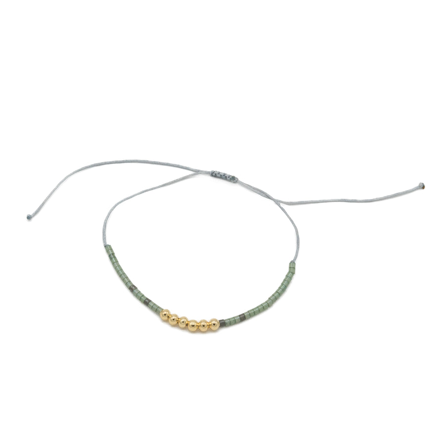 Pulsera de hilo con dorado y miyuki